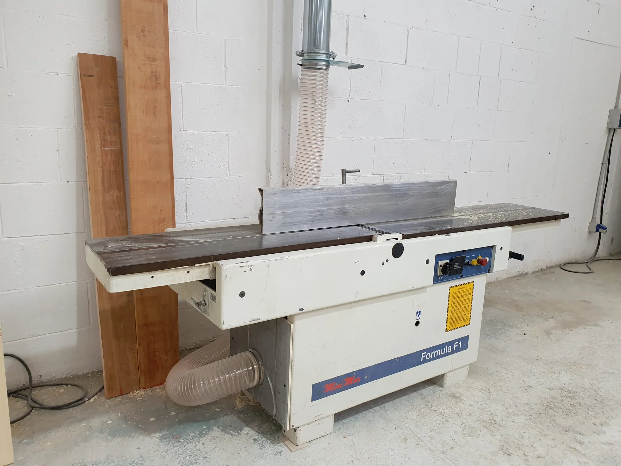 Overview of the carpentry workshop with multiple work stations active