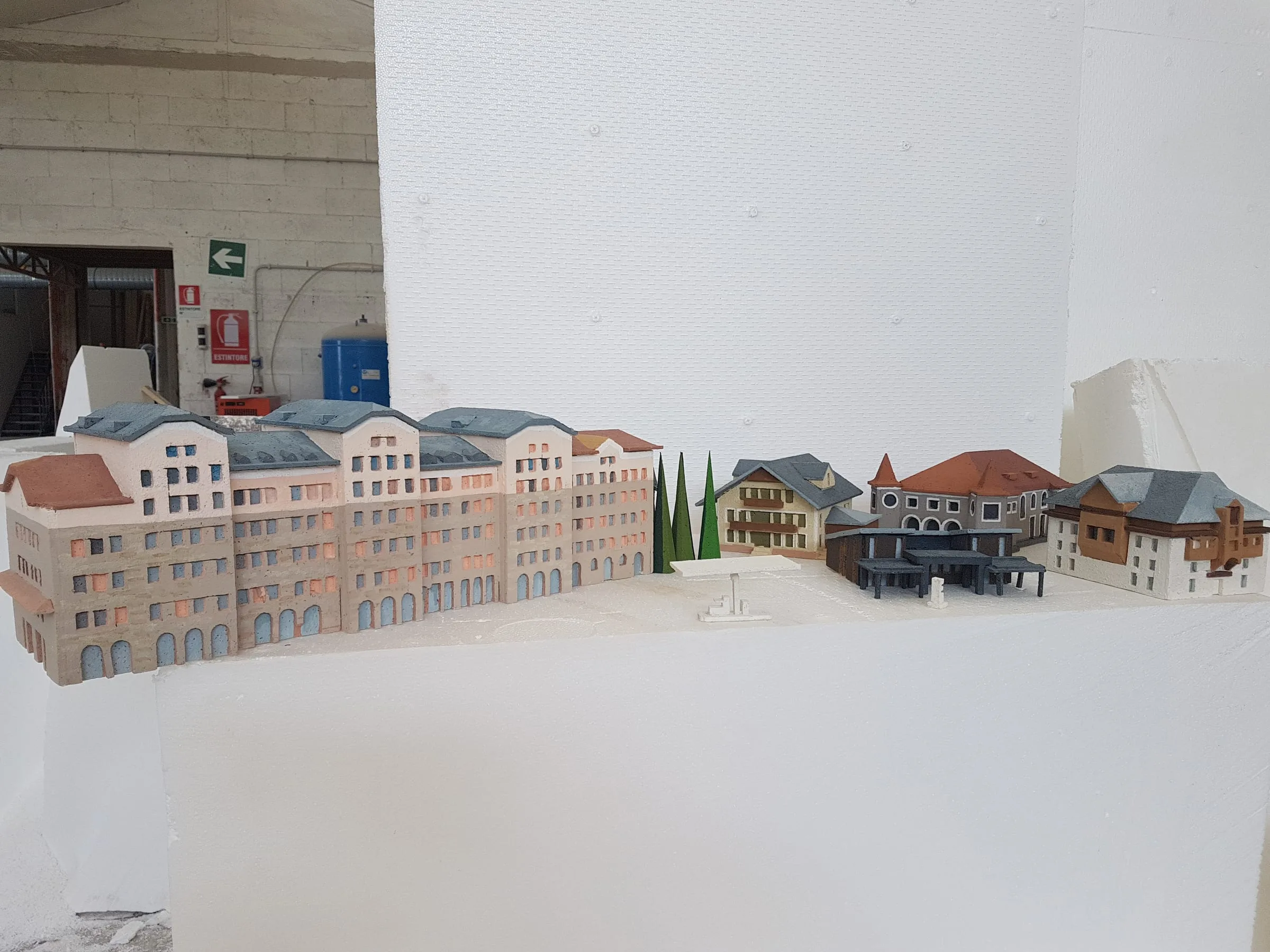 The village taking shape: houses already laid, mountains still rough