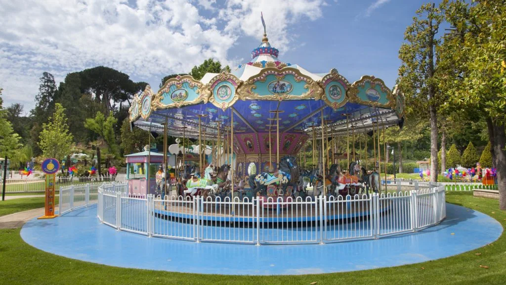 The 'Re Artù' carousel at Luneur Park: medieval merry-go-round in wood and wrought iron with black and white horses