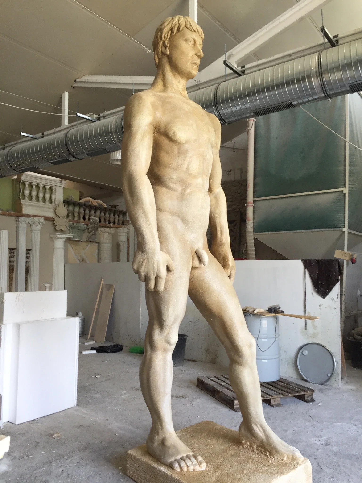 Polykleitos's Doryphoros in the workshop: rear or three-quarter view during fabrication, detail of the back muscles sculpted according to the classical Greek Canon
