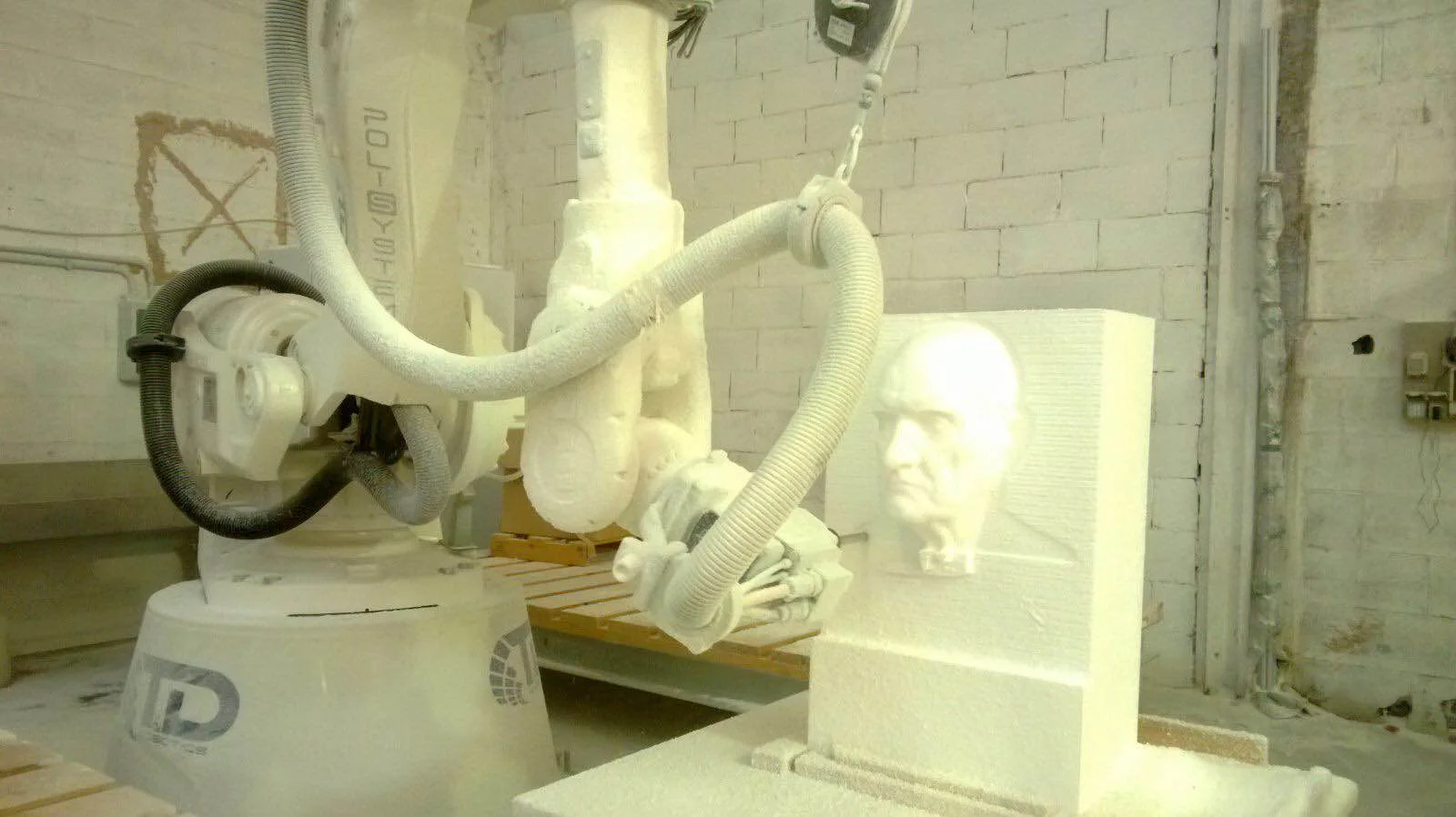 Piece sculpted by the 3D robot in progress: polystyrene block with milling traces still visible on the surface, before hand finishing