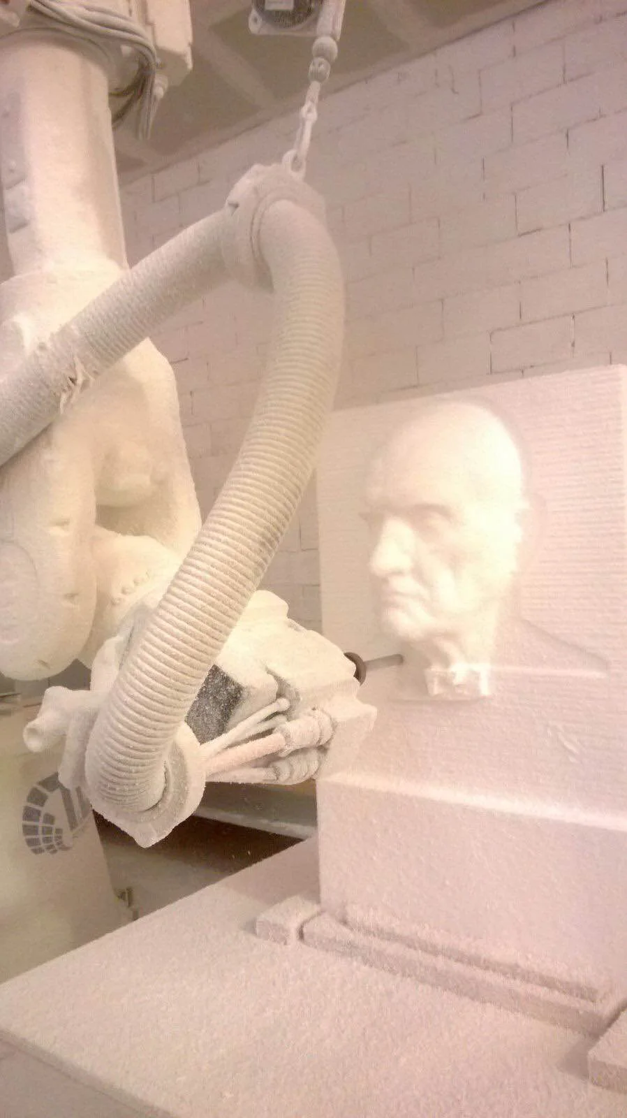 Full-round statue modelled by the CNC robot in our workshops: female figure in high-density polystyrene, face detail