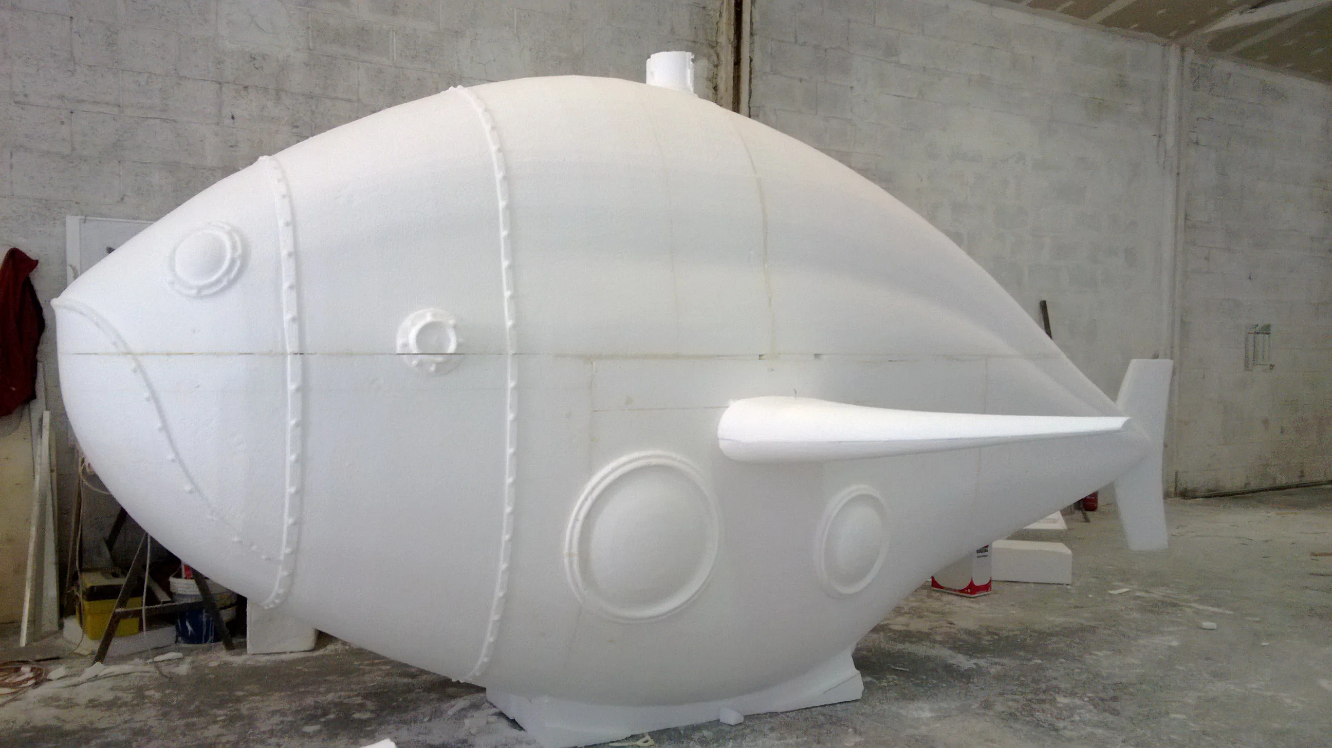 Component of a theme-park scenography being milled, overview of the piece in the workshop